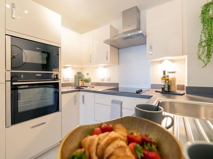 a kitchen with white cabinets