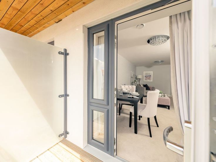 a room with a desk and chairs