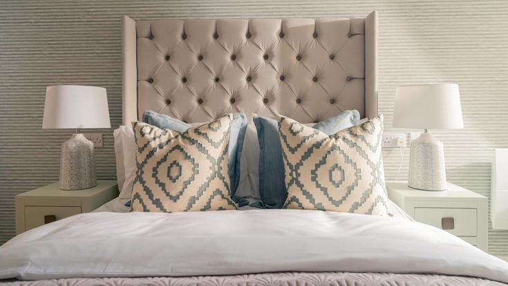 a bed with a white bed spread