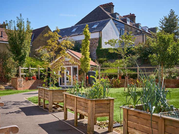 a backyard with a table and chairs