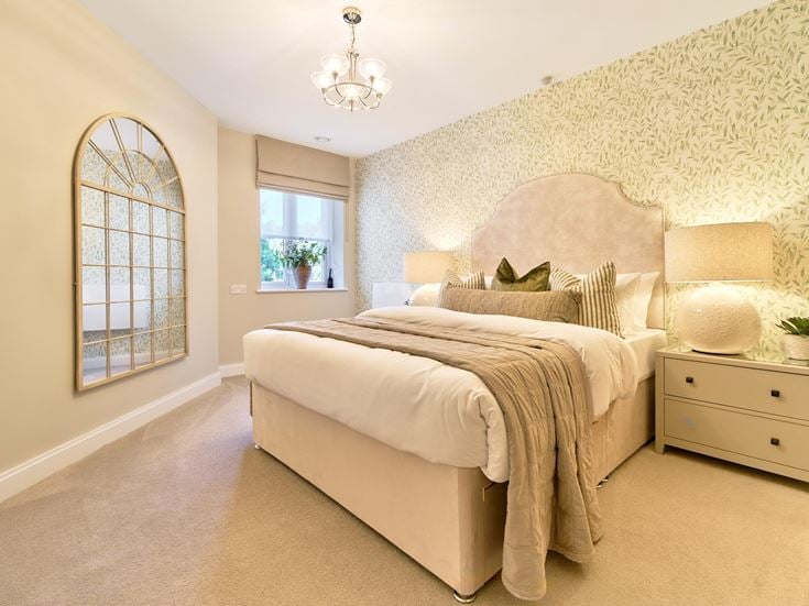 a bedroom with a bed and a large rock sculpture