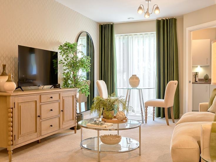 a living room with a tv and furniture