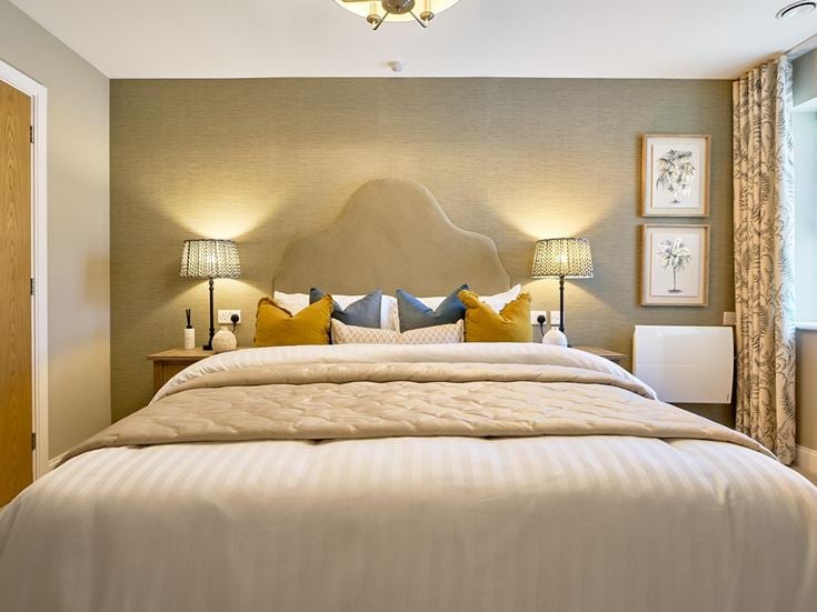 a bed with a large headboard
