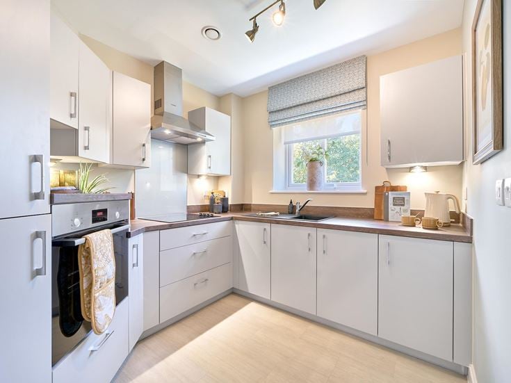 a kitchen with white cabinets