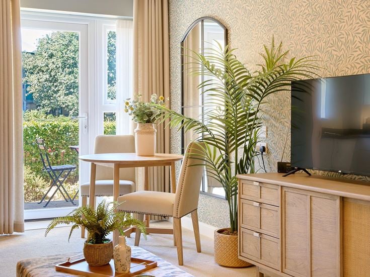 a room with a table and chairs