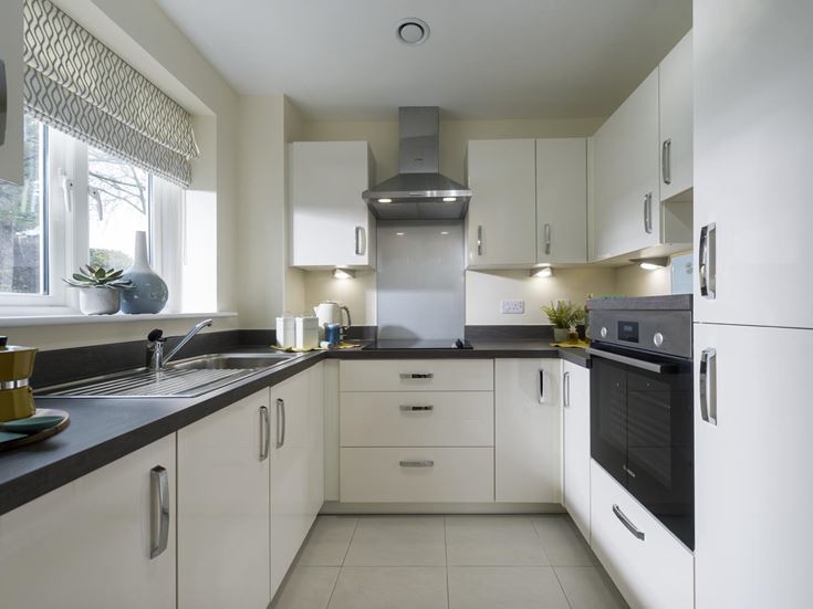 a kitchen with white cabinets