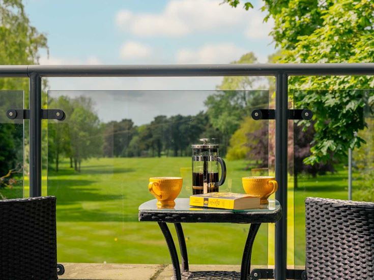 a glass table with a glass and a glass on a table