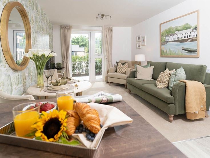 a living room with a couch and a table