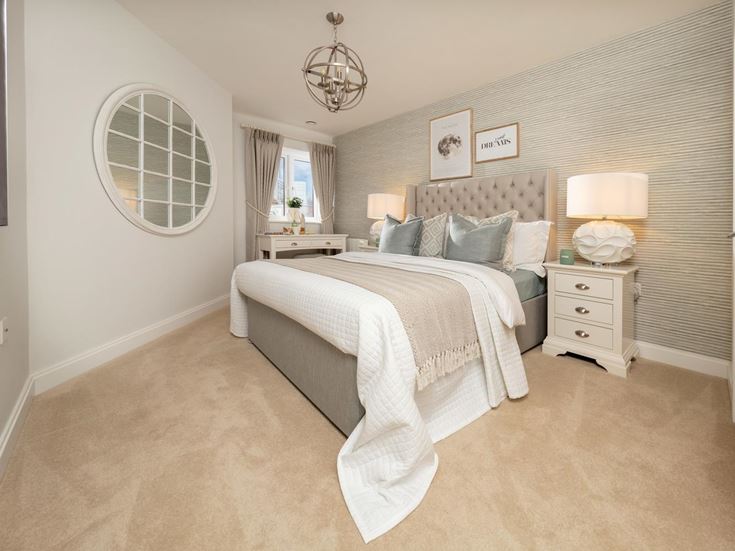 a bedroom with a bed and a mirror