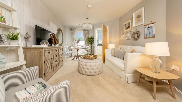 a living room with a couch and a table