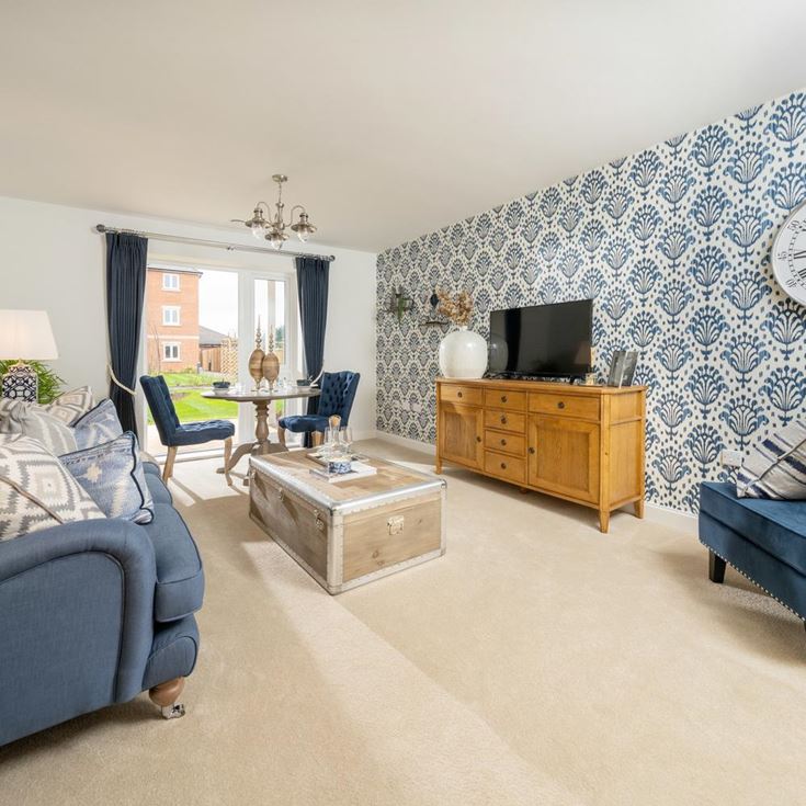 a living room with a blue wall