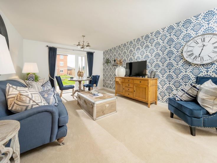 a living room with a blue wall