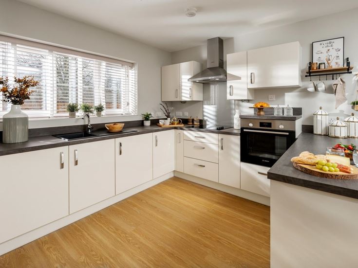 a kitchen with white cabinets