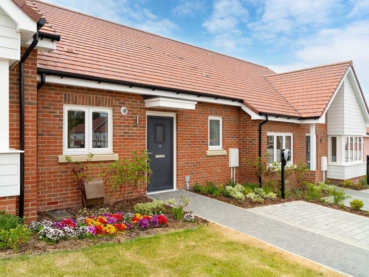 a brick house with a driveway