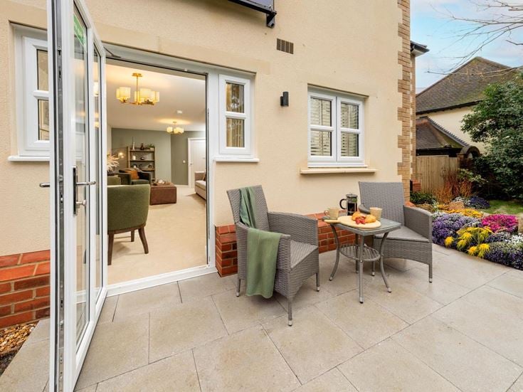 a patio with a table and chairs
