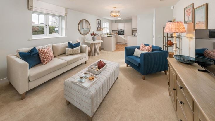 a living room with a couch and a table