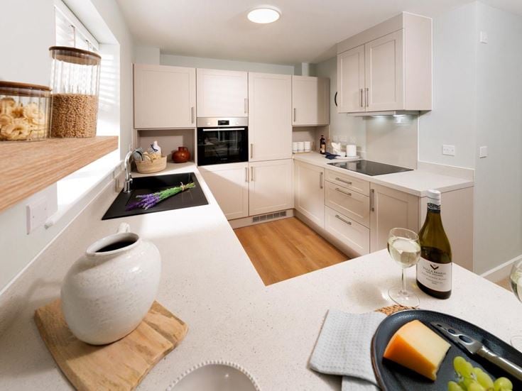 a kitchen with white cabinets