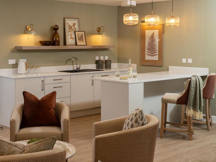 a kitchen with a dining table and chairs
