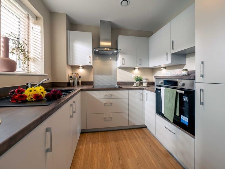 a kitchen with white cabinets