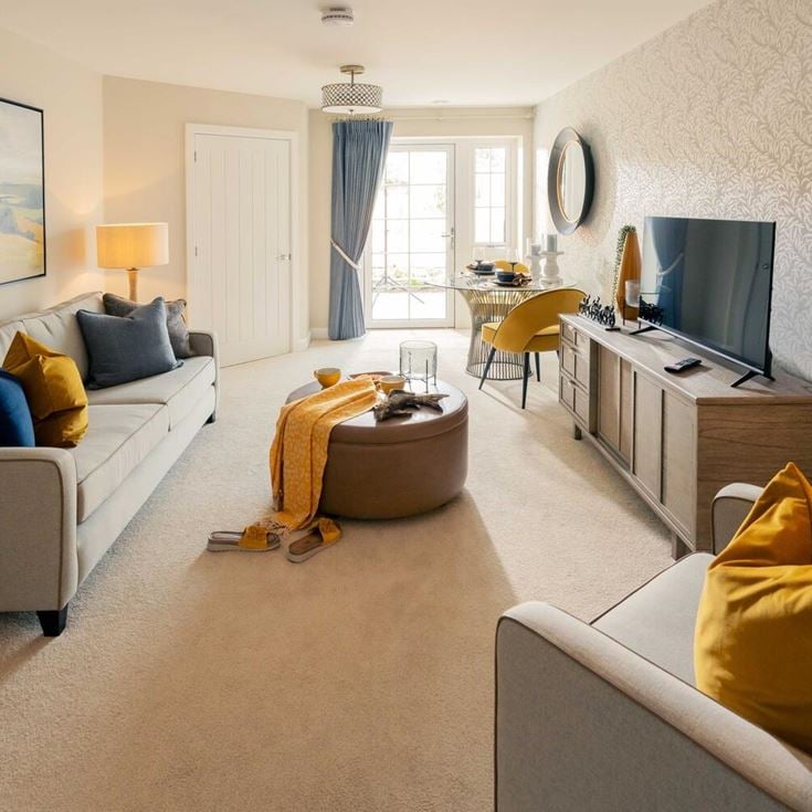 a living room with a tv and couches