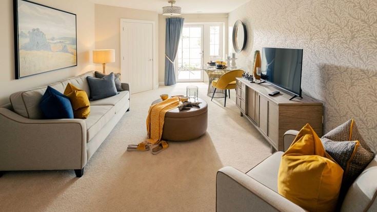 a living room with a tv and couches