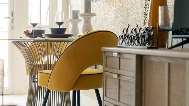 a yellow chair in a room