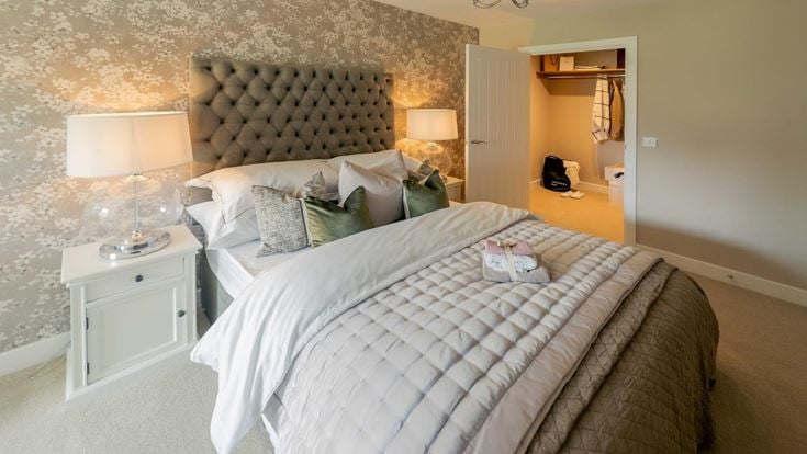 a bed with a white bed spread
