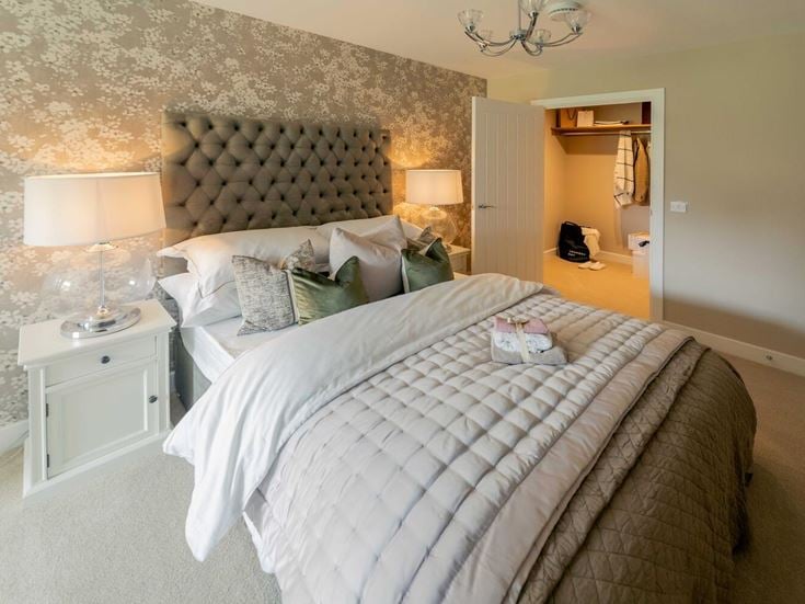 a bed with a white bed spread