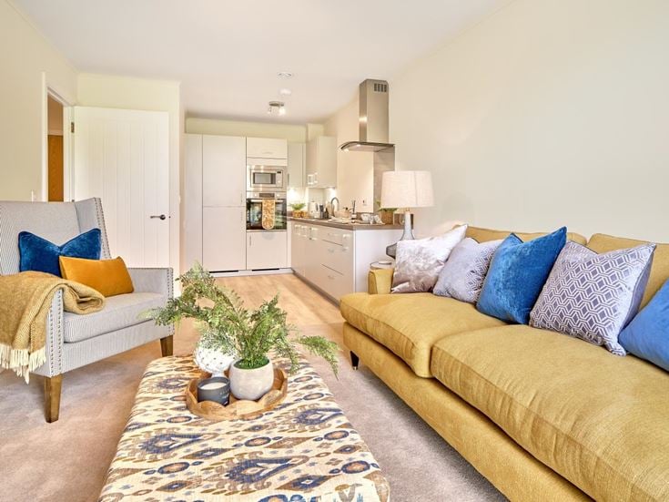 a living room with a couch and a table