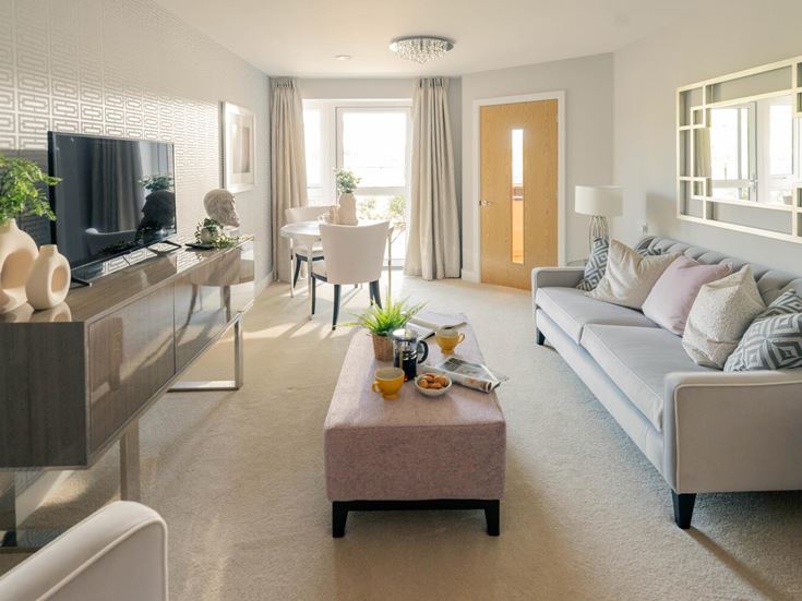 a living room with a couch and a table