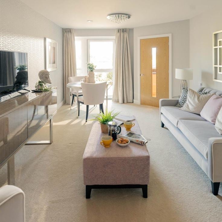 a living room with a couch and a table
