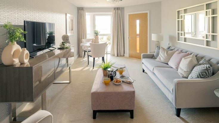 a living room with a couch and a table