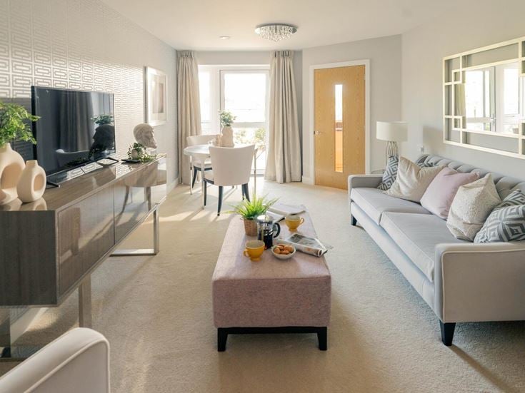 a living room with a couch and a table