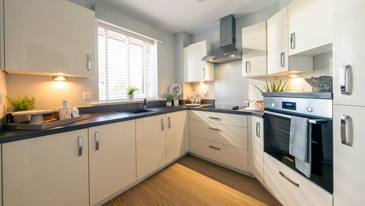 a kitchen with white cabinets