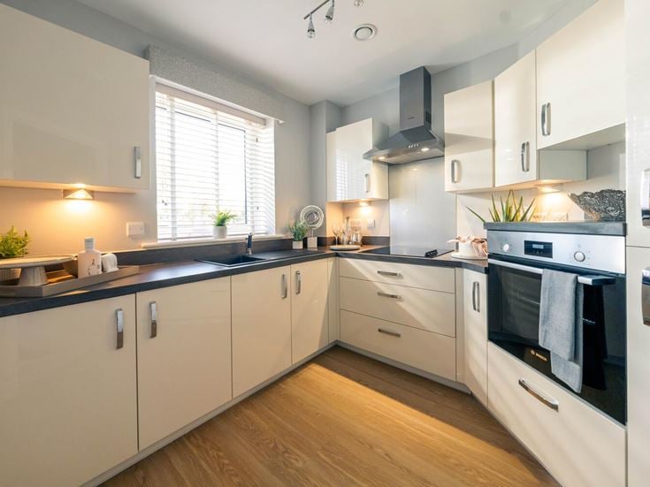 a kitchen with white cabinets