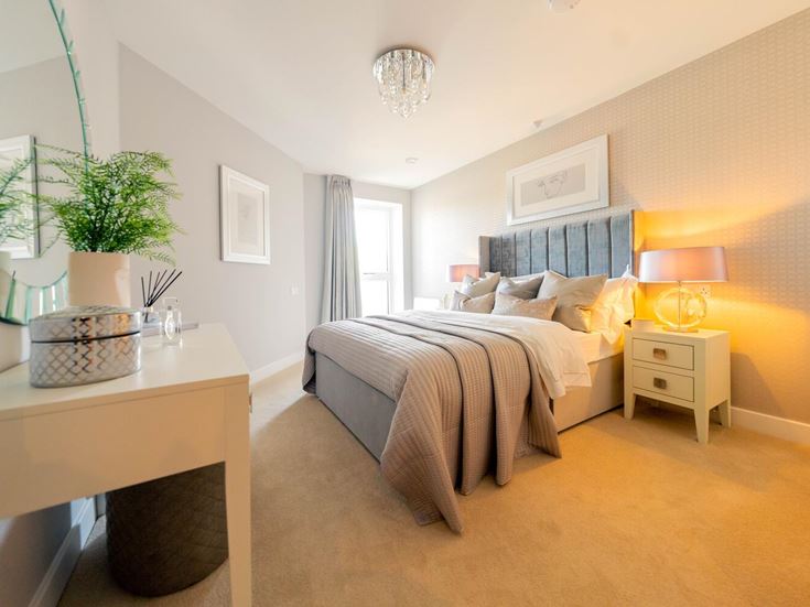 a bedroom with a bed and a table