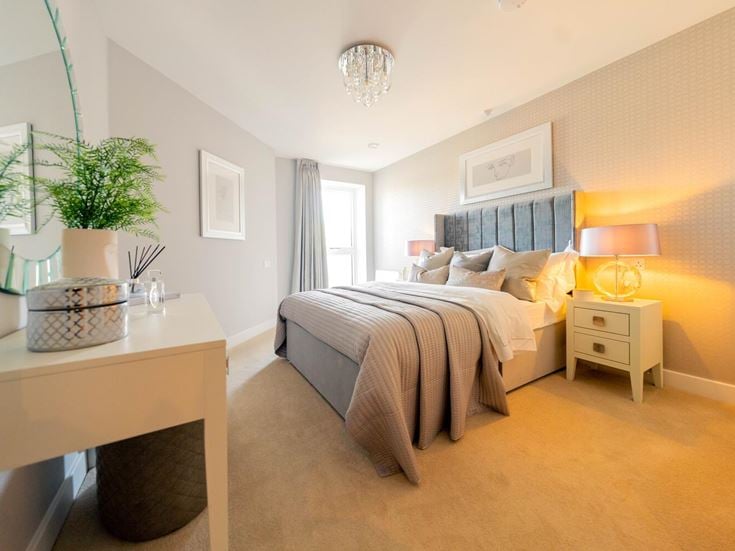 a bedroom with a bed and a table
