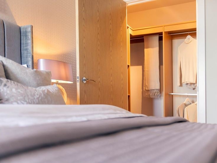 a bed with a lamp on it