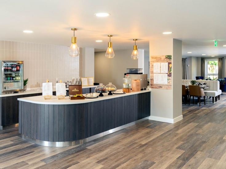 a kitchen with a bar and a bar