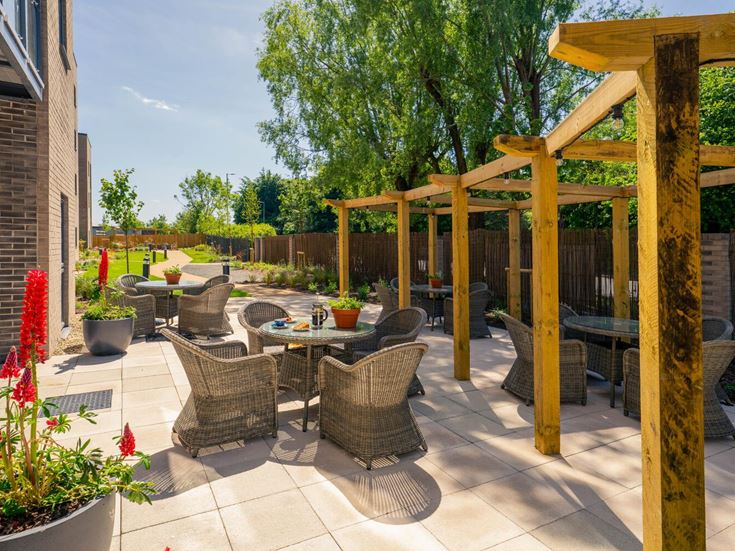 a patio with tables and chairs