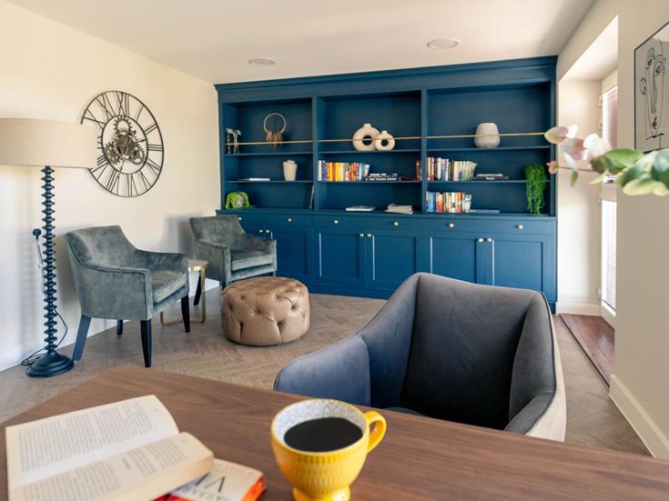 a living room with a blue cabinet