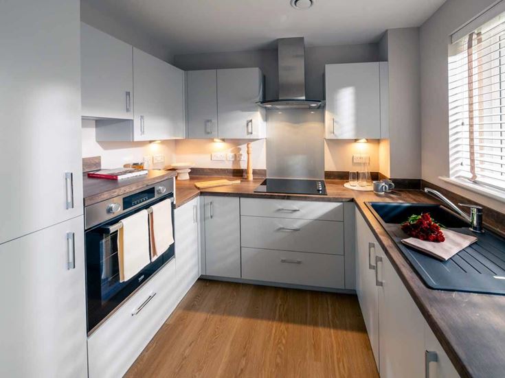 a kitchen with white cabinets