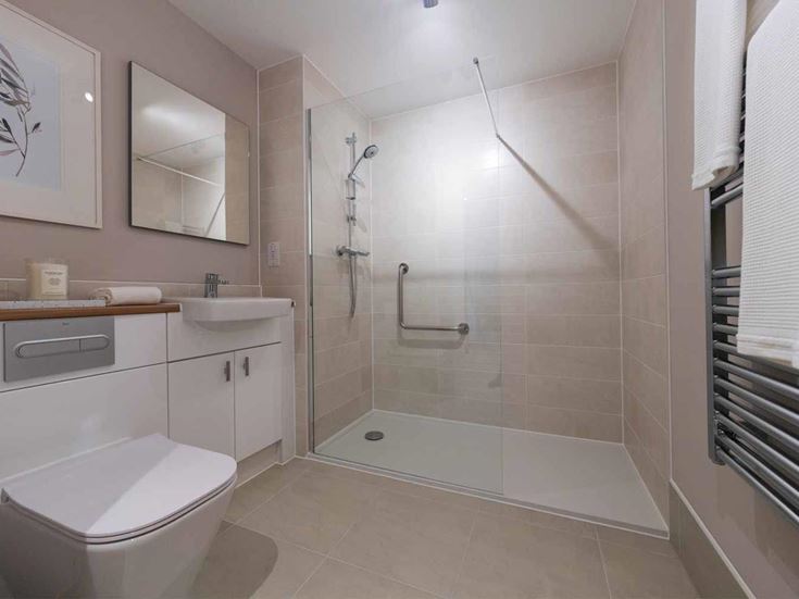 a bathroom with a shower and toilet