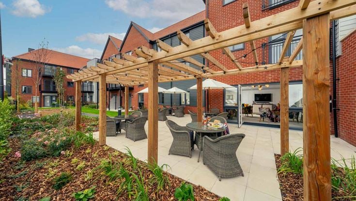a patio with a table and chairs