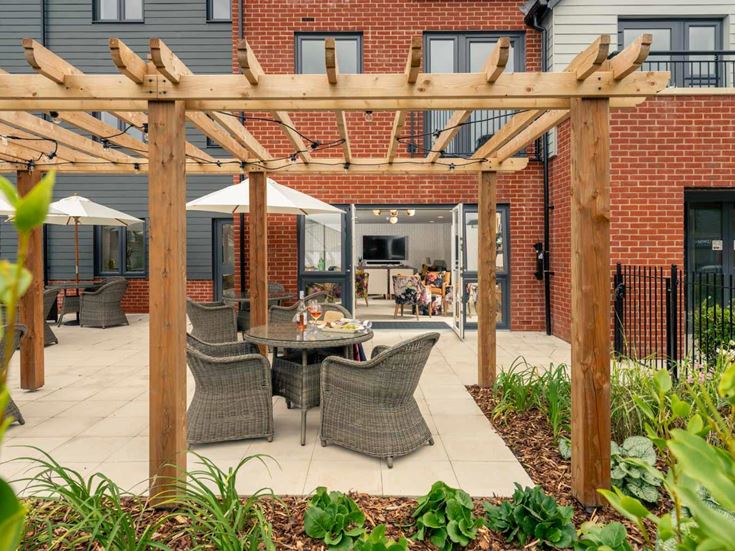 a patio with tables and chairs