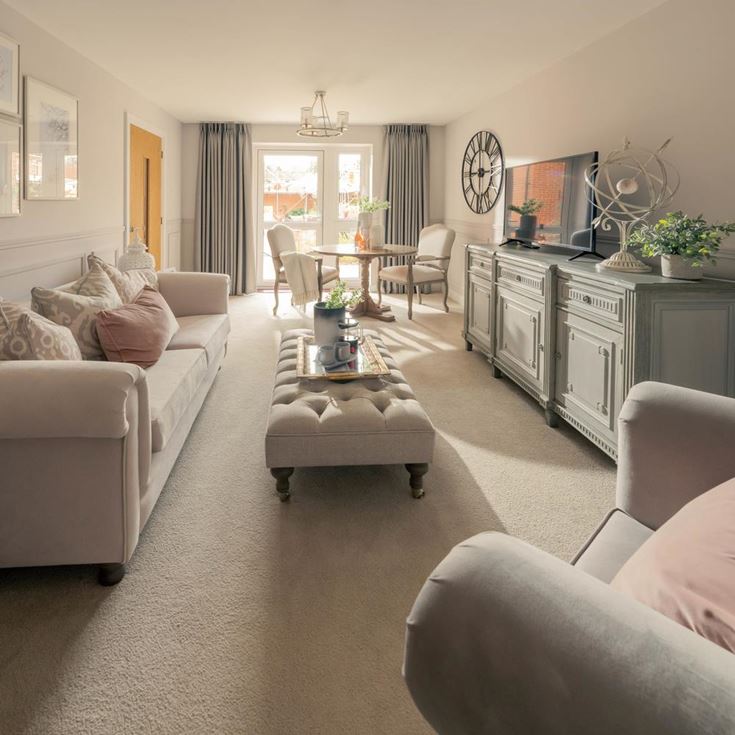 a living room with a couch and a tv