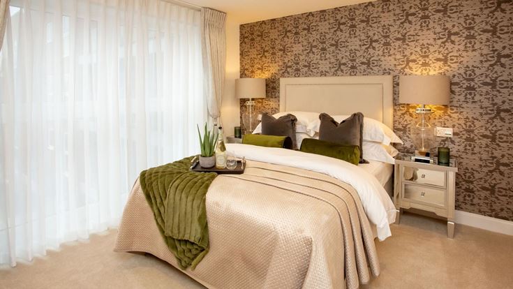 a hotel room with a bed and lamps
