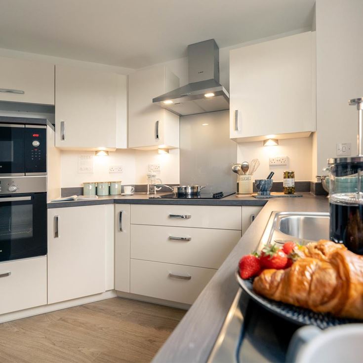 a kitchen with white cabinets