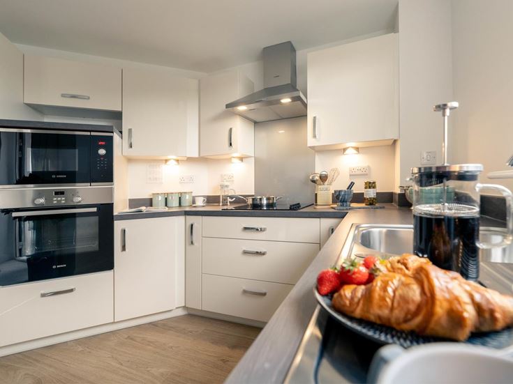 a kitchen with white cabinets