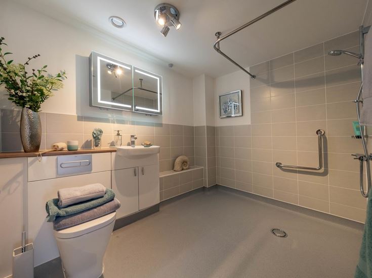 a bathroom with a tub toilet and sink